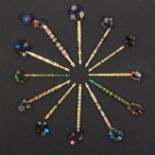 Twelve bone lace bobbins various including brass wire bound, bead bound, gold tinsel spiral, a