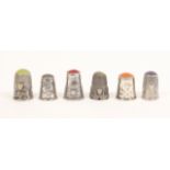Six early 20th Century continental white metal thimbles five with stone tops (one cracked) and one