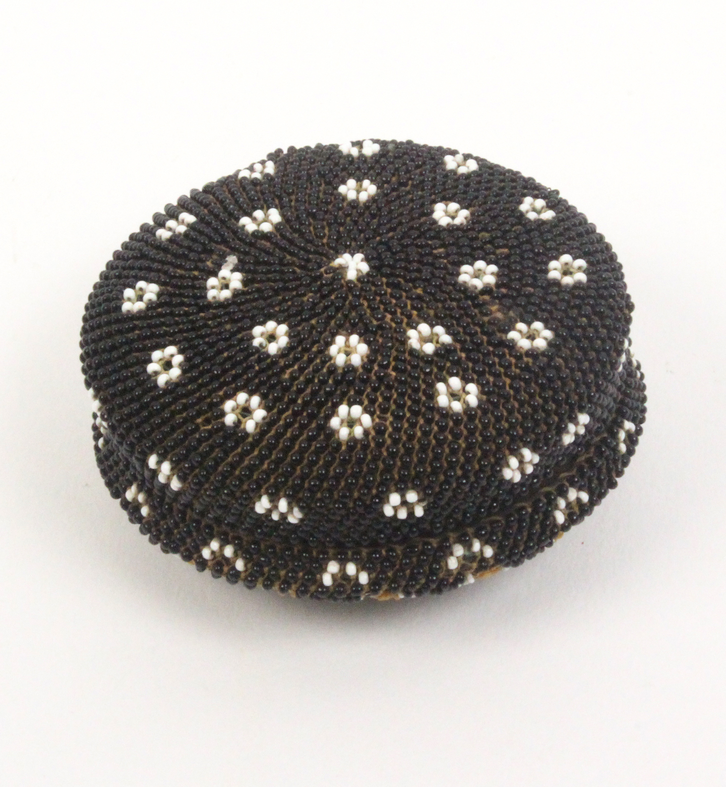 A good beadwork covered circular horn box, circa 1840, the lid with a geometric design in coloured - Image 2 of 2