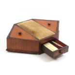 A mid-19th Century satinwood sewing companion of hexagonal form, the central pin cushion flanked