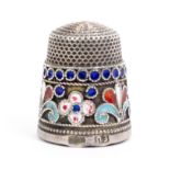 An early 20th Century Russian silver and cloisonnŽ enamel thimble, the frieze enamelled with