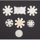 Seven mother of pearl silk winders comprising three snowflakes including an engraved Chinese pair