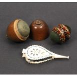 Three pin cushions comprising a Tunbridge ware double ended turned mosaic example, 3cm, a bone cut