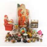 A collection of vintage Christmas decorations including Christmas Santa houses, pressed paper
