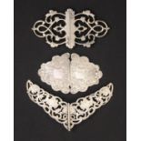 Three two part silver buckles comprising a shaped and engraved example, Birmingham, 1901 by