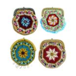 Four small format 19th Century beadwork purses each with a flowerhead motif within floral borders,