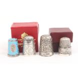 Four recent royal commemorative silver thimbles comprising - EII coronation coach in original box/