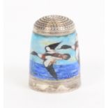 A silver and enamel thimble by Peter Swingler depicting ducks in flight, initialled 'PS', makers