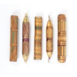 Five split and coloured straw work needle/bodkin cases all of geometric design, two with pointed