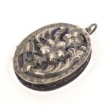 A silver pin cushion for a chatelaine of oval form pierced to each side with flowers and leaves,