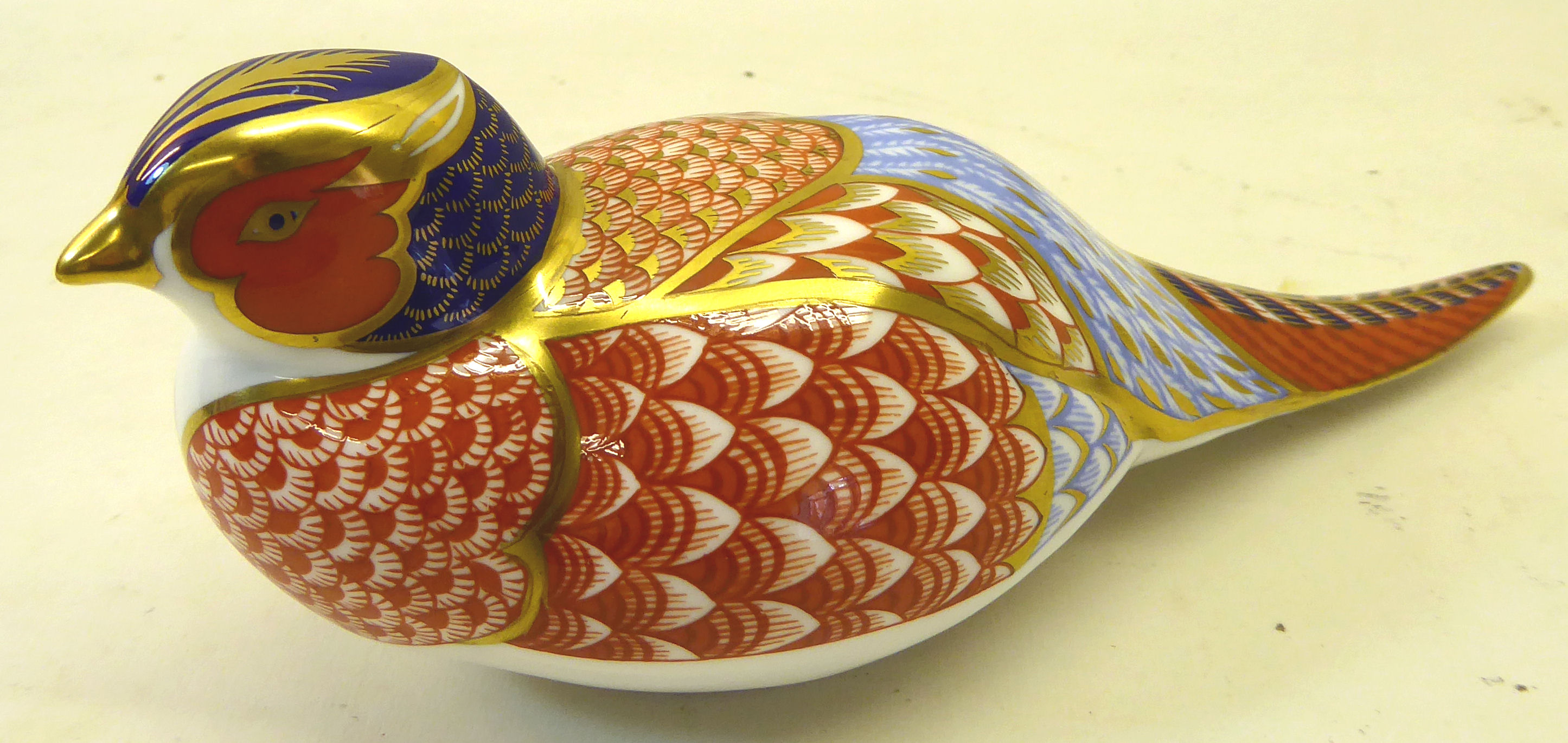 A Royal Crown Derby pheasant Paperweight with gold stopper.