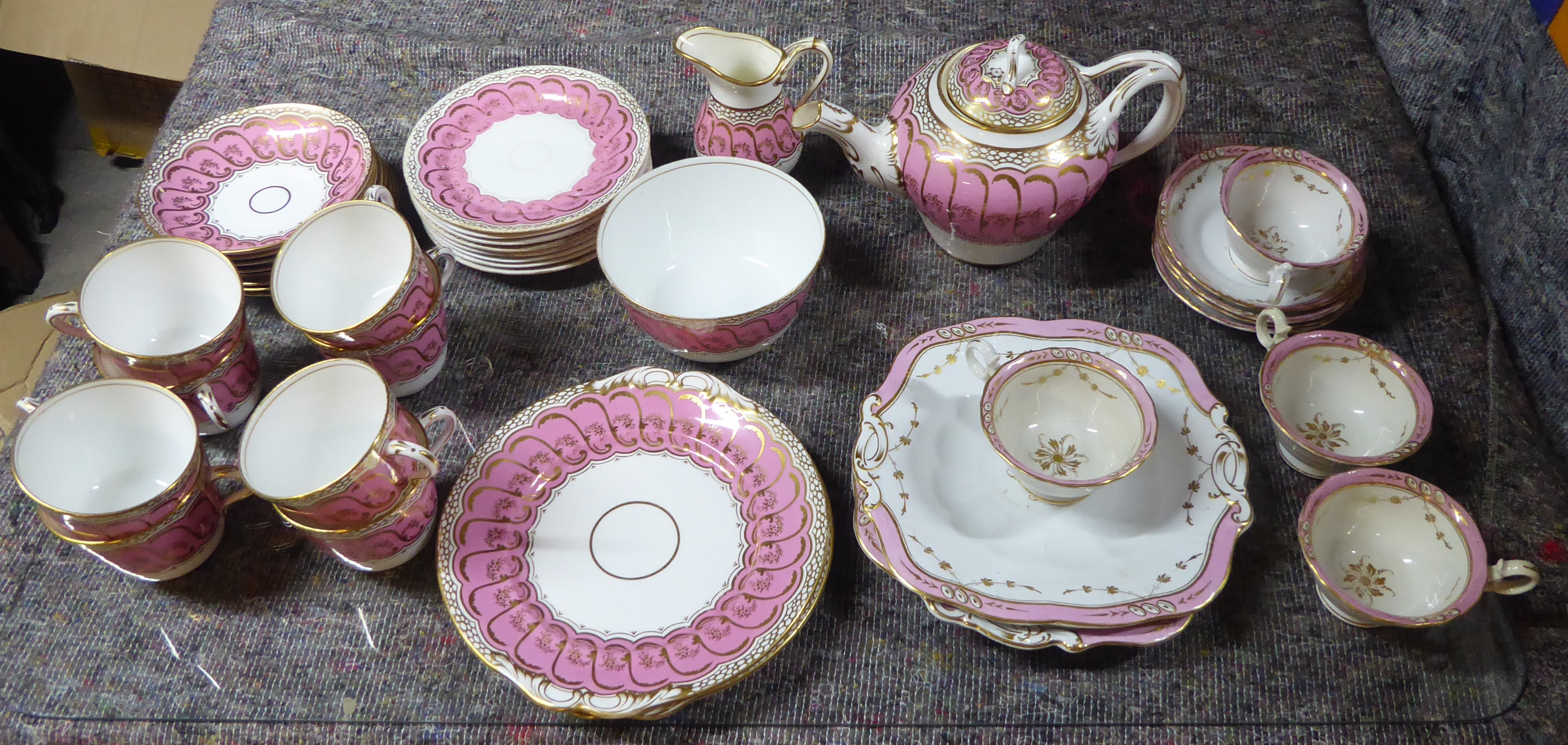 A Victorian Tea Set decorated in pink and gilt, comprising eight large cups and saucers, eight
