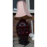 A red glass and metal banded Table Lamp and shade.