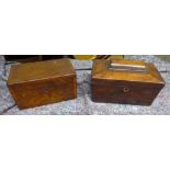 A 19th century mahogany Tea Caddy with cross banded decoration, the interior fitted with two covered