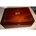 A Victorian rosewood Sewing Box with fitted interior.