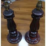 A pair of mahogany Table Lamps with carved leaf decoration. 13" (33cms) high.