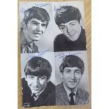 A Photograph of the four members of The Beatles with printed signatures, Dezo Hoffmann copyright. 6"