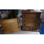 A pine miniature Chest of three long and two short Drawers, 12" (31cms) wide, and a pine