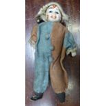 A small Doll in Italian costume with painted face and glass eyes, 8 1/2" (22cms) high.