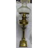 A brass Table Oil Lamp with glass shade, Corinthian column and stepped square base, 31" (79cms)