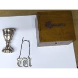 A Victorian silver Decanter Label by George Unite, a small French engraved silver cup and a wooden