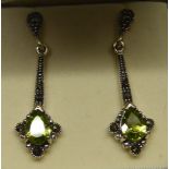 A pair of silver pendant Earrings set with peridot and marcasite.