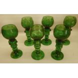 A set of six German green Hock Glasses with etched bowls and knulled stems.