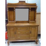 An early 20th century oak Sideboard with raised mirrored back, three centre drawers and two