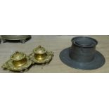 A 19th century Pewter Capstan Inkwell, and a Rococo style brass Inkstand fitted with two covered