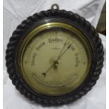 A large Aneroid Barometer and Thermometer in rope twist frame, 11" (28cms) diameter overall.