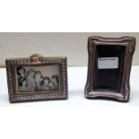 A silver oblong Table Photograph Frame with embossed decoration, London 1985, 3 1/2" (9cms) x 4 1/2"