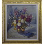 •DOUGLAS STANNUS GRAY (1890-1959); Still Life of a vase of flowers and a book on a table top, oil on