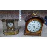 A Mantle Clock, the white dial inscribed "Comitti of London" in domed mahogany case, and another