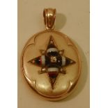 A high carat unmarked oval gold Locket, the hinged cover decorated with applied agate bands set with