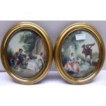 A pair of oval coloured Aquatints of Classical figures in oval metal frames. 9" (23cms) x 8" (