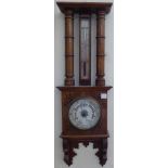 An Aneroid Barometer and Thermometer in incised oak case, 27" (69cms) high.