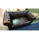 A Chesterfield brown leather settee