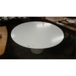 An Arkana circular dining table