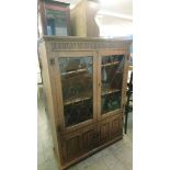 Oak leaded glass bookcase