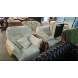 A cream three piece suite and footstool