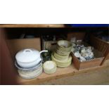 Shelf of various dinner china