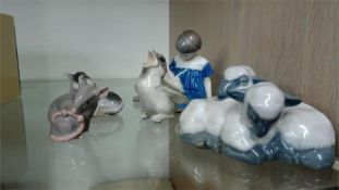 Four Bing and Grondahl figures and a Royal Copenhagen figure