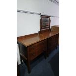 An oak chest of drawers and a dressing chest