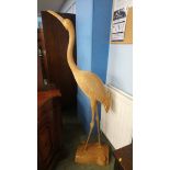 A large carved wooden flamingo