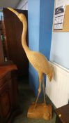 A large carved wooden flamingo