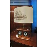 A table lamp and barometer