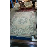 A large Chinese design beige carpet