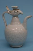 A Chinese ewer, modelled with a phoenix. 21 cm high