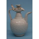 A Chinese ewer, modelled with a phoenix. 21 cm high