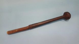 An early steel club, with wooden handle and embossed decoration, 37cm